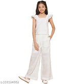 White cotton schiffli embroidered cuff sleeve top and elasticated pant girls set, self-design Indian kurta with bottomwear on model